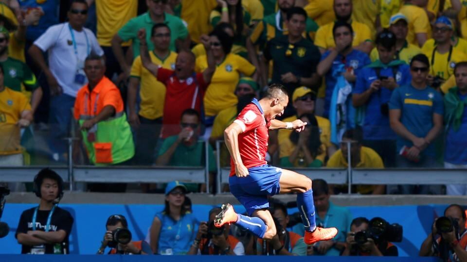 Chile’s Alexis Sanchez celebrates after scoring the equaliser at the Mineirao Stadium in Belo Horizonte . Photograph: Toru Hanai / Reuters