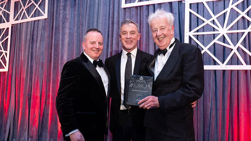 Barry Hennessy, business development & marketing director, Walls Construction, presents the architectural practice of the year to Martin Donnelly and Finghín Curraoin, Henry J Lyons