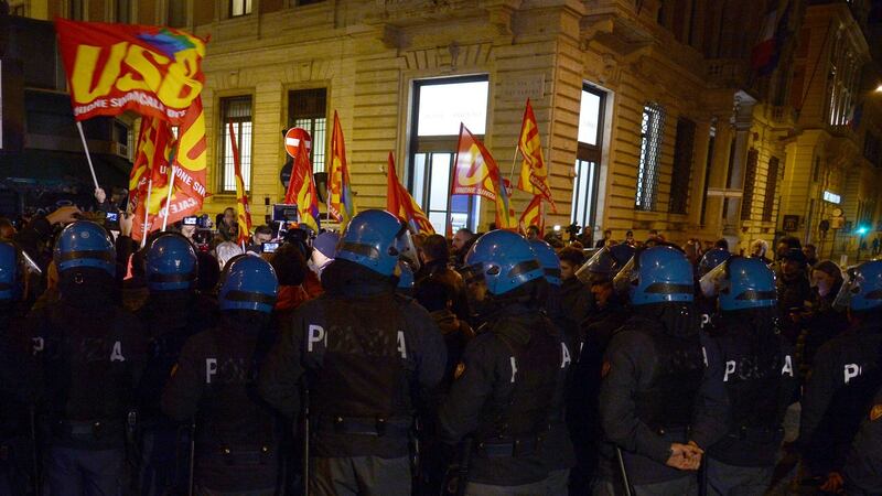 Police watch as supporters of a “No” vote in the constitutional referendum in Italy rally after the end of the vote in Rome. Photograph: Filippo Monteforte/AFP/Getty Images