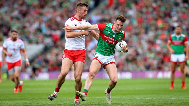 Mayo’s Matthew Ruane is tackled by Brian Kennedy of Tyrone. Photograph: Ryan Byrne/Inpho