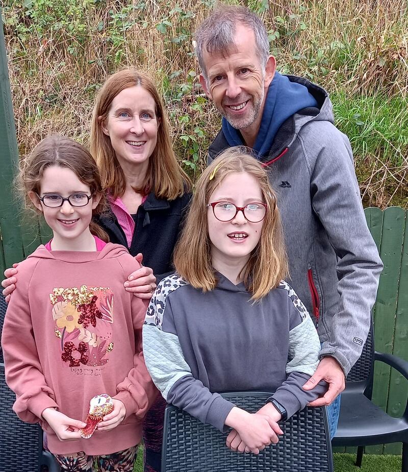 Molly Marshall (12) who has mobility issues with her mum Maire, dad Cornelius and sister Nell.