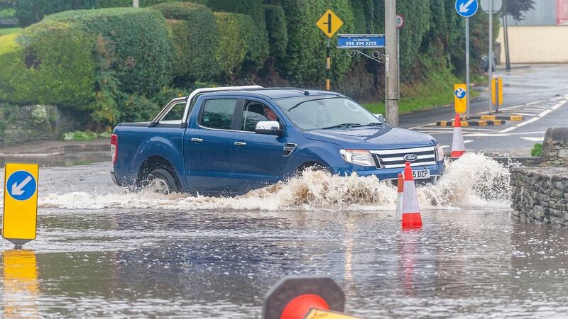 A motorist tried to drive through flooded roads in Rosscarberry, West Cork over the weekend. Photograph: Andy Gibson