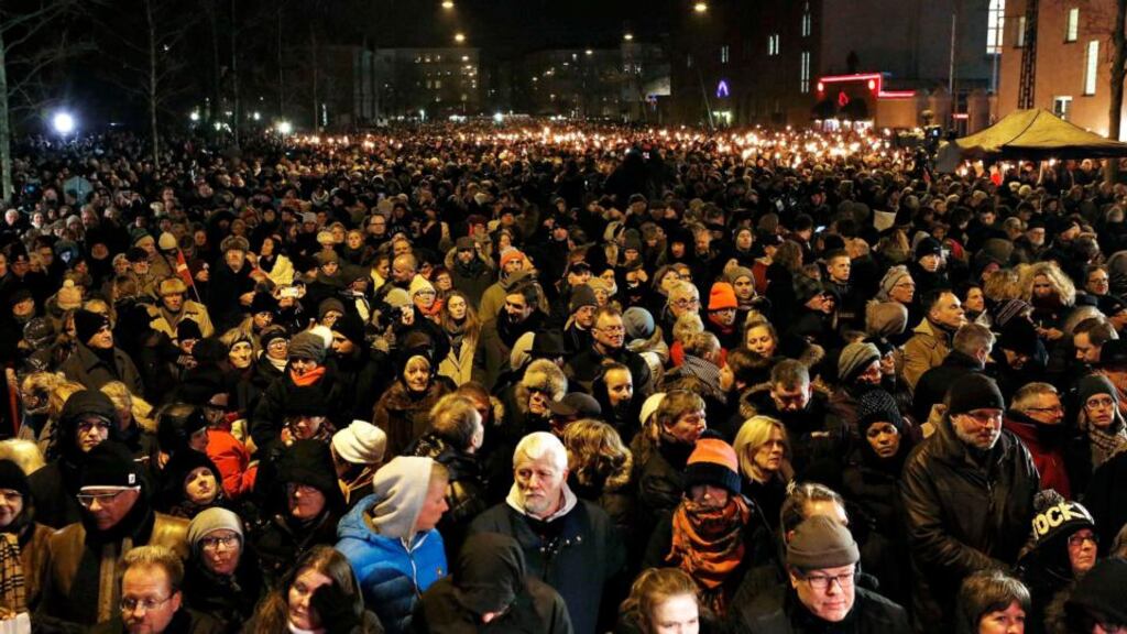 People attend a memorial service for victims of deadly attacks on a synagogue and an event promoting free speech, in Copenhagen. Photograph: Linda Kastrup/Scanpix /Reuters