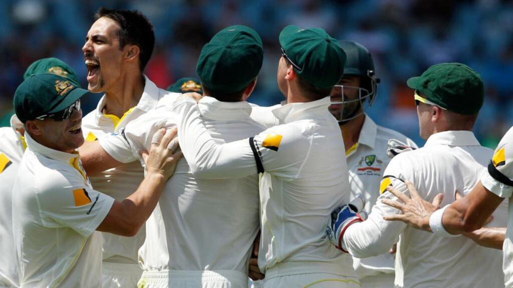 Australia’s Mitchell Johnson celebrates with team-mates after the dismissal of South Africa’s captain Graeme Smith during the second day of the first Test match in Centurion, South Africa. Photograph: Siphiwe Sibeko/Reuters