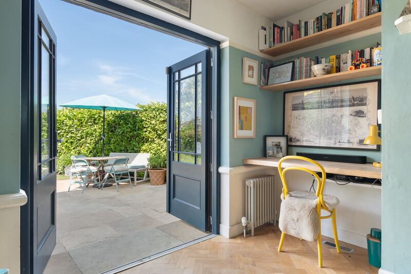 Doors in the livingroom open out to a patio