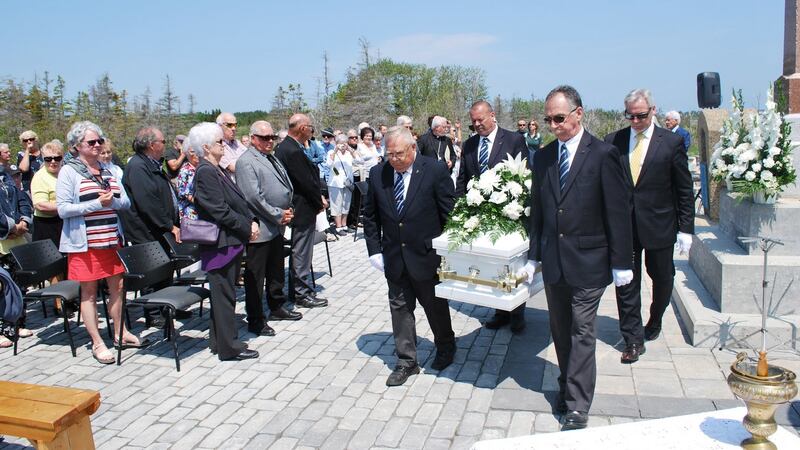 The remains of the 21 were laid to rest following a ceremony on Thursday at the Irish Memorial on Cap-des-Rosiers Beach. Photograph: Parks Canada/PA