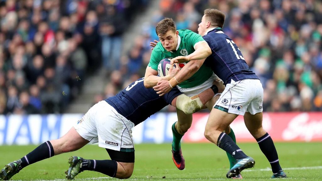Ireland’s Garry Ringrose is tackled by Scotland’s Zander Fagerson and Huw Jones during the Six Nations game at Murrayfield. Photograph:  Billy Stickland/Inpho