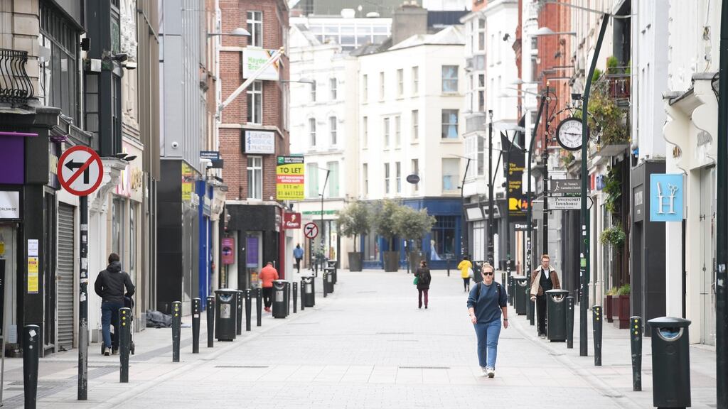 An almost-deserted Grafton Street in Dublin on Wednesday. Our reality is that the economy has been shut down not by debts, spending, a property bubble, too much lending or bad policy, but by a virus. Photograph: Aidan Crawley/EPA