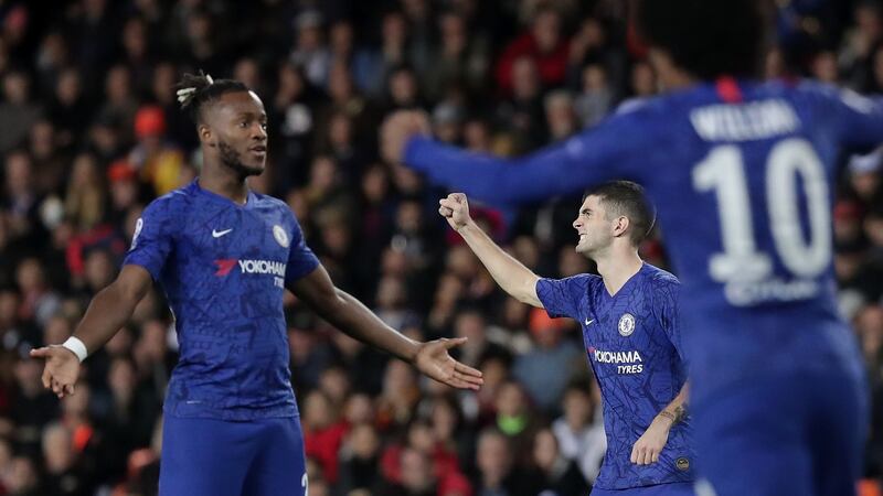 Christian Pulisic of Chelsea celebrates with team-mates Michy Batshuayi and Willian after a VAR review awards the team’s second goal during the Champions League Group H match against Valencia at the Mestalla at the Mestalla. Photograph: Gonzalo Arroyo Moreno/Getty Images