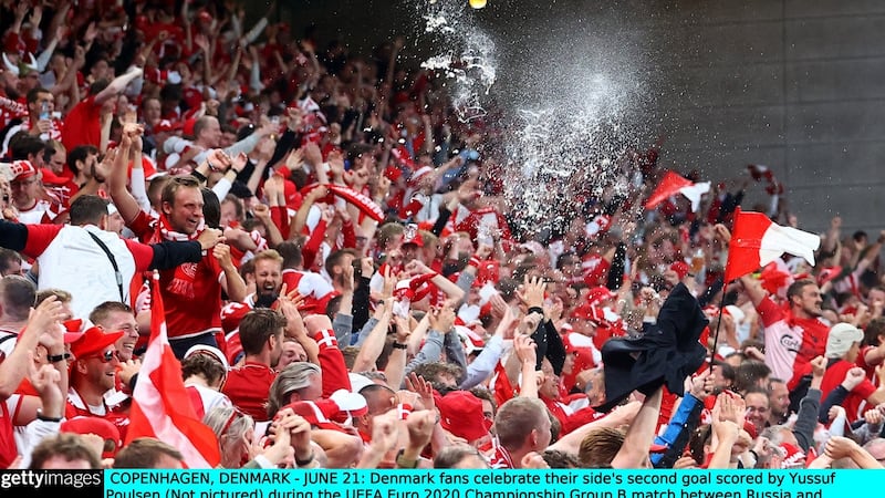 Danish fans celebrate during the game. Photo: Wolfgang Rattay - Pool/Getty Images