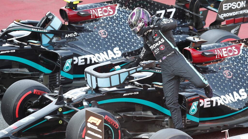 Mercedes’ driver Lewis Hamilton jumps out of his car after securing the pole position in the qualifying session at the Circuit de Catalunya in Montmelo near Barcelona. Photo: Alejandro Garcia/AFP via Getty Images