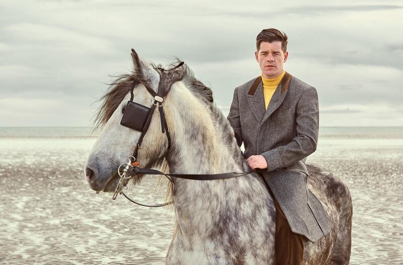 Paul Smith Collection: fly-front herringbone wool coat with velvet collar and roll-neck sweater. Photograph: James Mooney