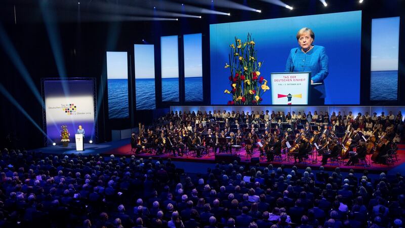 German chancellor Angela Merkel speaks during a reception to celebrate German Unification Day in Kiel. Photograph: Christian Charisius/dpa/AP