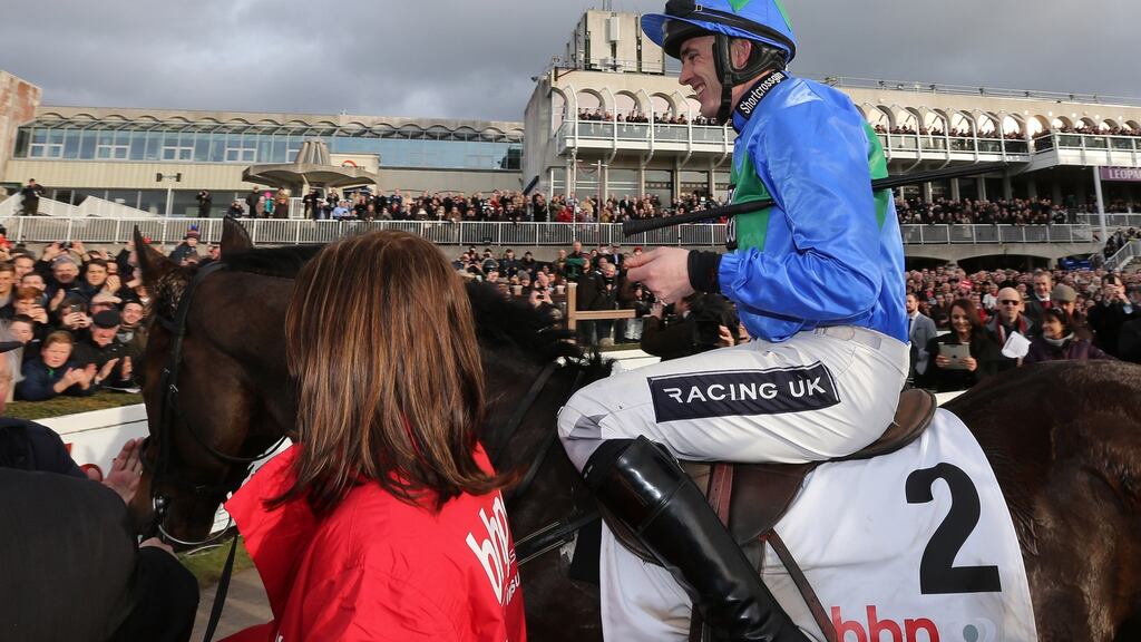 Jockey Ruby Walsh on Hurricane Fly celebrates in the parade ring after the race. Photograph: Cathal Noonan/Inpho