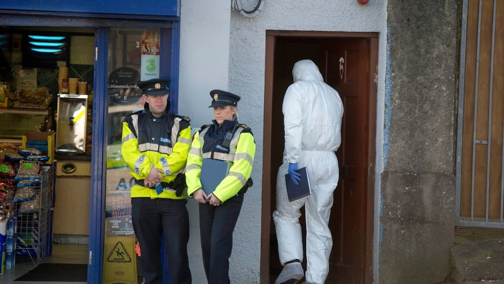 Gardaí at the scene on Popham’s Road, Cork where a woman’s body was found. Photograph: Michael Mac Sweeney/Provision