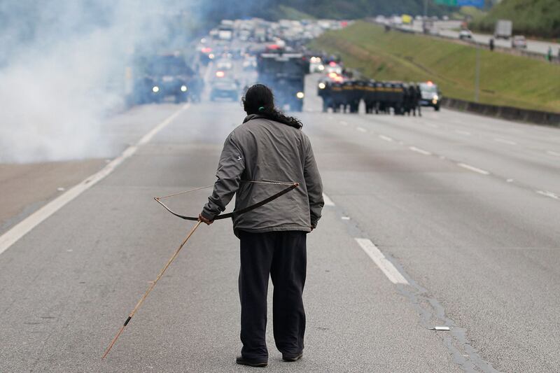 A Guarani Mbya indigenous man clashes with military police during a demonstration for their land rights at the Bandeirantes highway in Sao Paulo on May 30th. Photograph: Allison Sales/AFP via Getty
