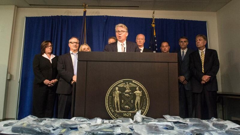 Cyrus Vance Jr, the Manhattan district attorney, center, announces the indictment of members and associates of the Bonanno crime family at a news conference in New York. Photograph: Robert Stolarik/The New York Times