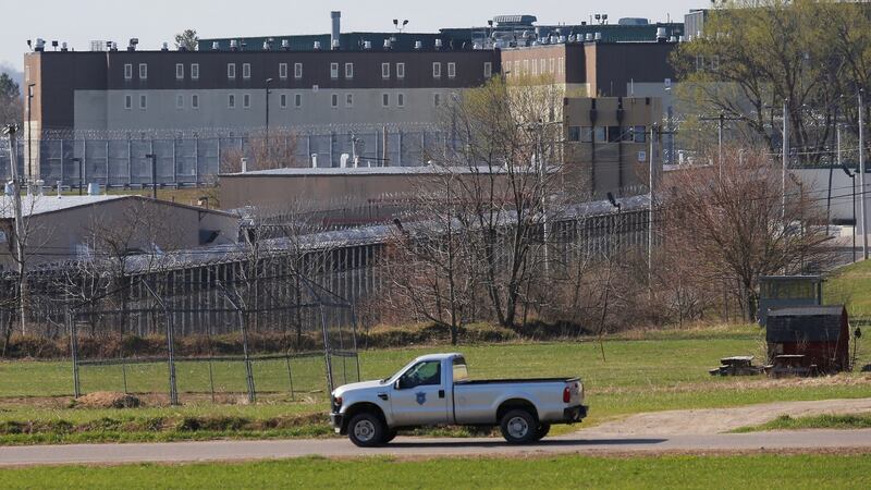 A prison vehicle drives past the Souza Baranowski Correctional Center in Shirley, Massachusetts where Hernandez was found dead in his jail cell. Photo: Brian Snyder/Reuters
