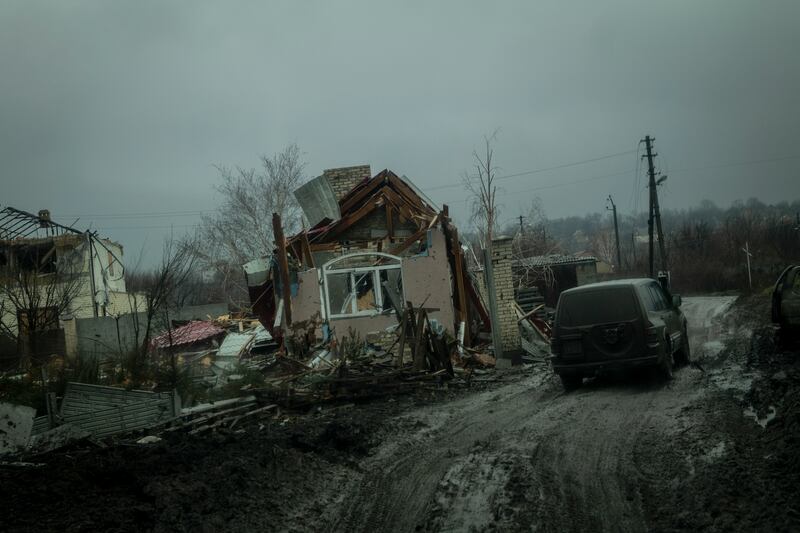 A Ukrainian military vehicle passes a destroyed building in Bakhmut. Photograph: Nicole Tung/New York Times