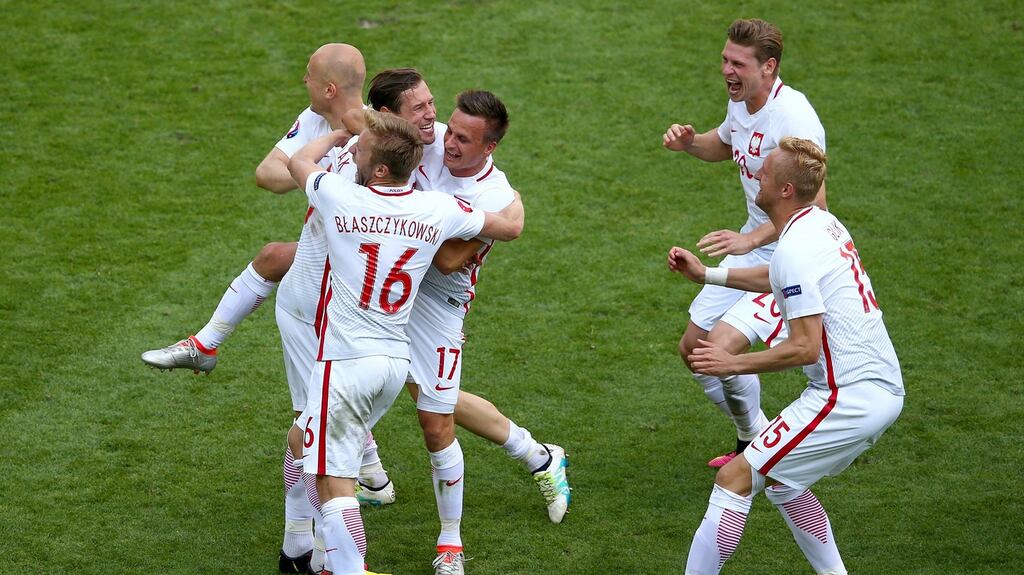 Poland players celebrate their penalty shoot-out win over Switzerland in Saint-Etienne. Photograph: Getty