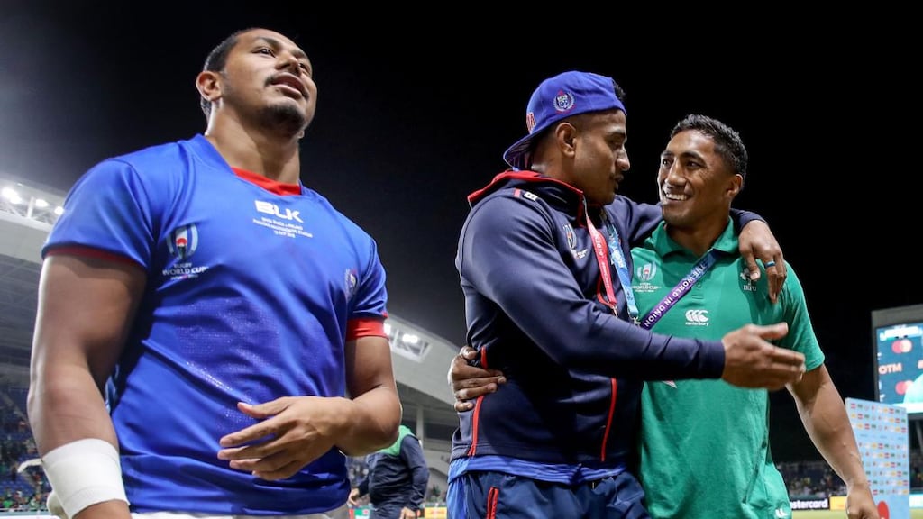 Bundee Aki hugs Samoa’s Rey Lee-Lo after Ireland’s win in Fukuoka. Photograph: Dan Sheridan/Inpho