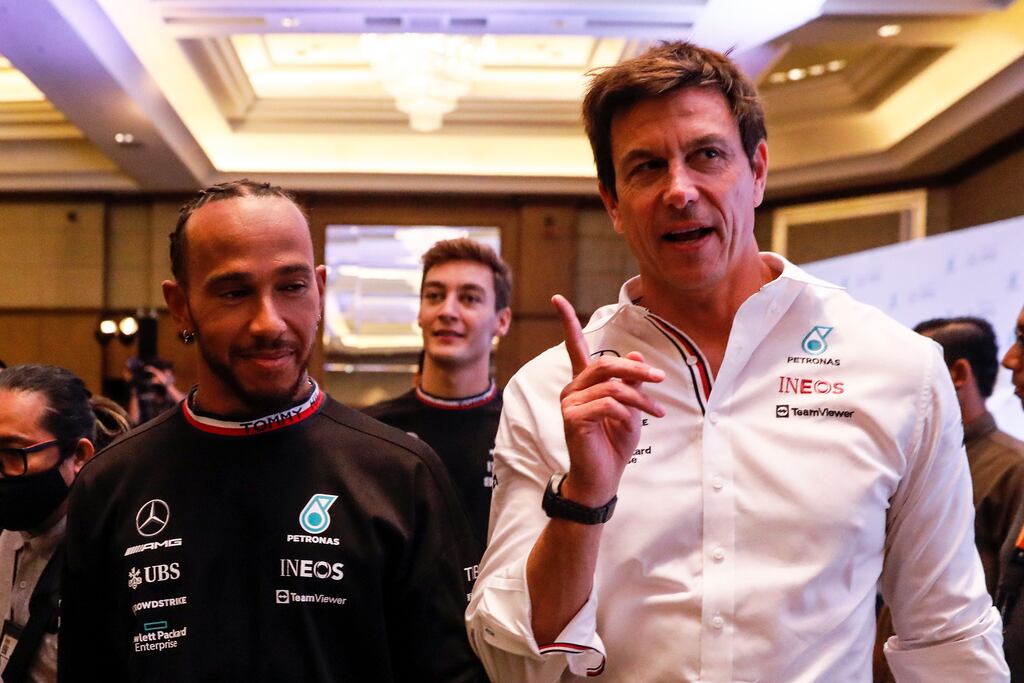 Team Principal and CEO of Mercedes-AMG Petronas F1 team Toto Wolff walking with his driver, Lewis Hamilton. Photograph: Fazry Ismail/EPA