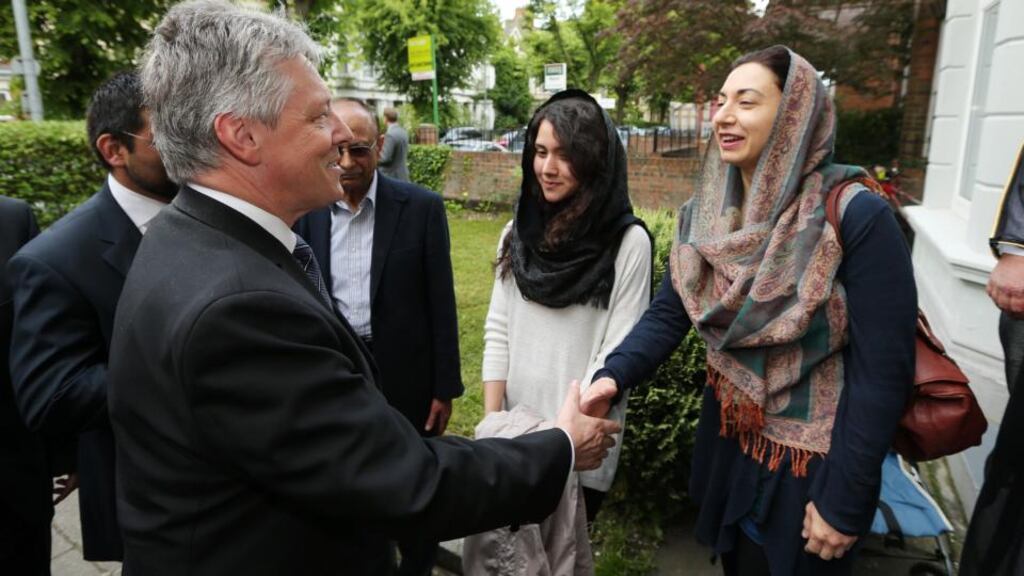 First Minister Peter Robinson with members of Muslim community during his visit to the Belfast Islamic Centre where made a public apology for any offence caused to Muslims by his defence of a controversial preacher. Photograph: Kelvin Boyes/Press Eye /PA