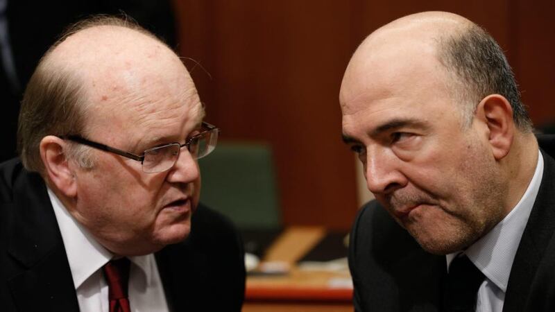 Minister for Finance Minister Michael Noonan and EU Commissioner in charge of Economic and Financial Affairs, Taxation and Customs Union, Pierre Moscovici at the start of the Eurogroup meeting of Finance ministers at the EU council headquarters, in Brussels, Belgium on Monday. Photograph: EPA