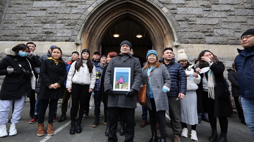 Ulambayar Surenkho holding a photograph of his late wife at the anniversary Mass which was held in St Kevins Church, Harrington Street, Dublin. Photograph Nick Bradshaw for The Irish Times