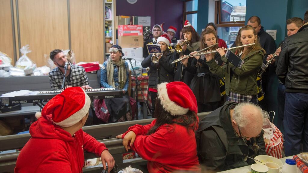 Jack O’Rourke and the Barrack Street Brass Band entertain the clients in Cork’s Penny Dinners. Photograph: Michael Mac Sweeeney/Provision