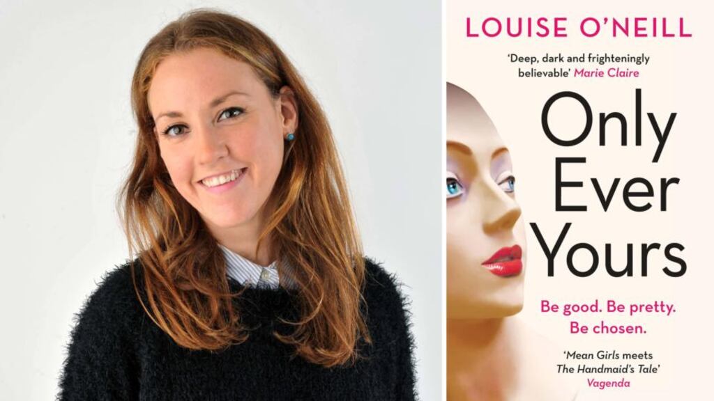 Louise O’Neill with the cover of the new adult edition of Only Ever Yours.