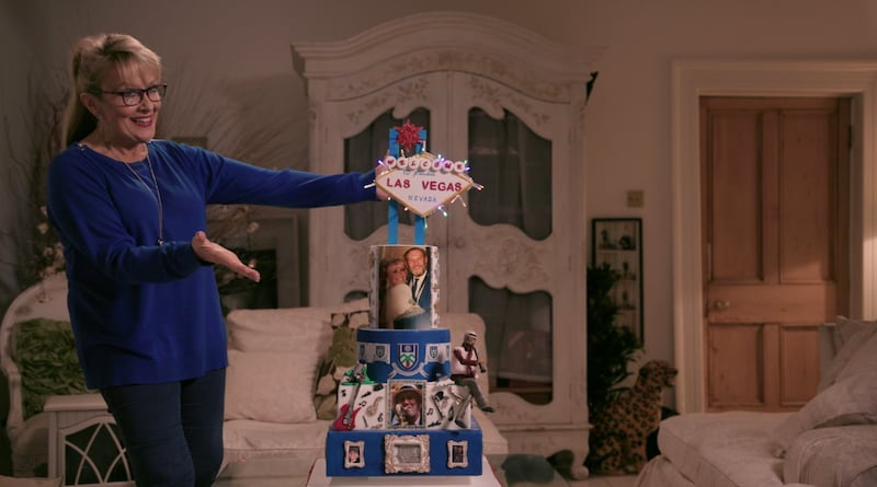 Twink shows off a  cake she made for musician Paddy Cole.