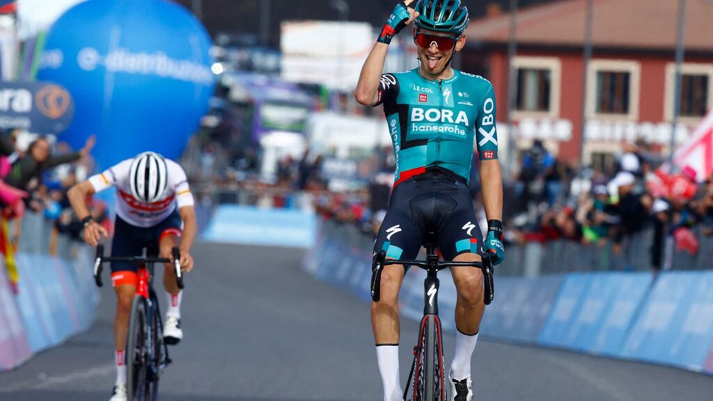 Team Bora’s Lennard Kamna celebrates as he crosses the finish line ahead of Team Trek’s Juan Pedro Lopez to win the fourth stage of the Giro d’Italia 2022 between Avola and Etna-Nicolosi, Sicily. Photograph: Luca Bettini/AFP/Getty