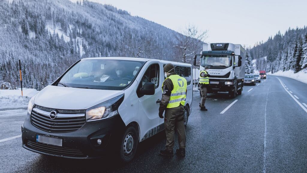 Soldiers of the Austrian armed forces talk with drivers queuing at the Thurn high mountain pass in Jochberg in Austria’s Tyrol region. Photograph: STR/EXPA/AFP via Getty