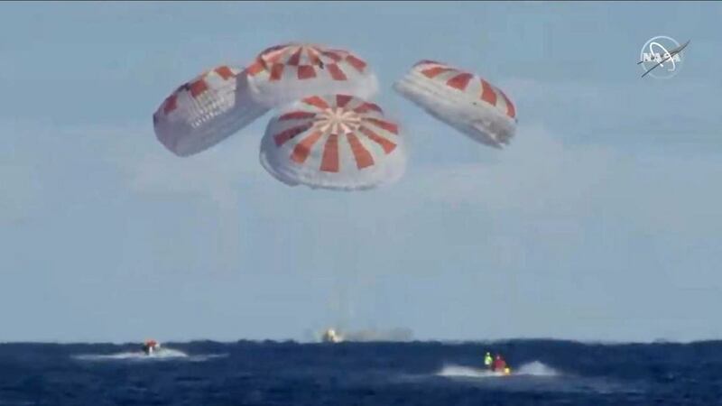 This still image taken from Nasa TV, shows the splashdown of the SpaceX Crew Dragon capsule in the Atlantic Ocean. Photograph: Jose Romero/Nasa TV/AFP