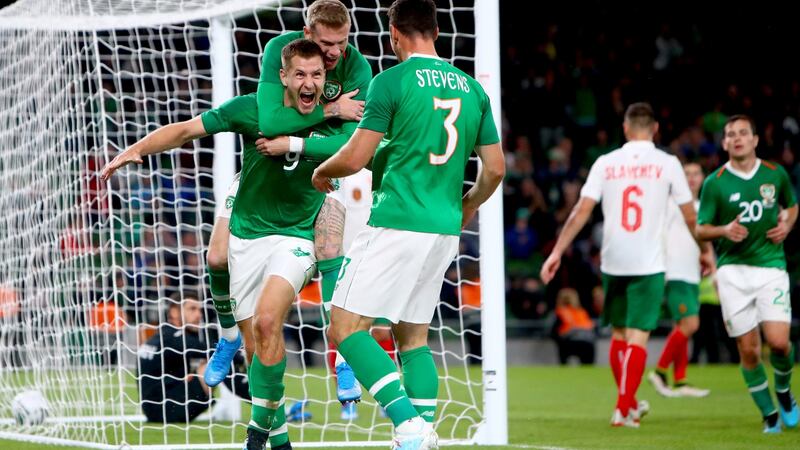 Ireland’s James Collins celebrates scoring his side’s third goal with James McClean during the friendly win over Bulgaria. Photo: James Crombie/Inpho