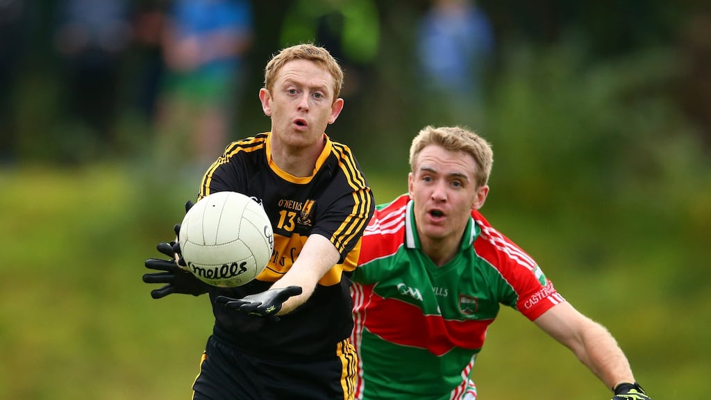 Dr Crokes’ Colm Cooper is pursued by Loughmore-Castleiney’s Noel McGrath in the Munster club football championship semi-final. Photograph: Cathal Noonan/Inpho
