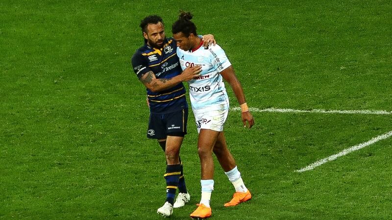 Isa Nacewa consoles Teddy Thomas after Leinster’s narrow Champions Cup win over Racing 92. Photograph: James Crombie/Inpho