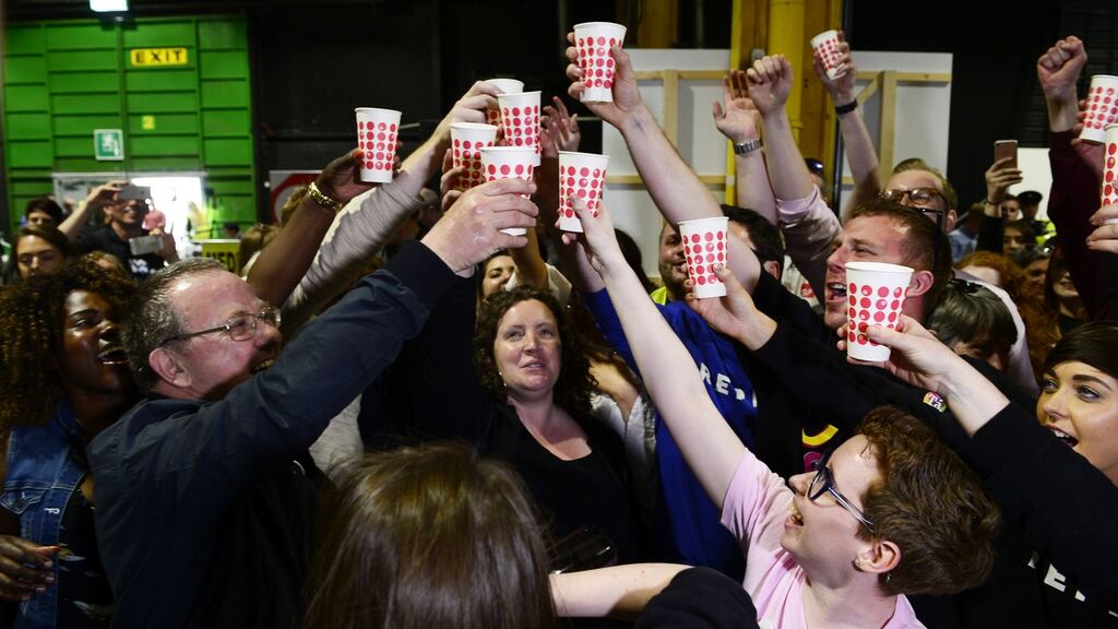 Campaigners salute the outcome of the vote to remove the Eighth Amendment from the Constitution at the RDS count centre in May. File photograph: Cyril Byrne/The Irish Times.