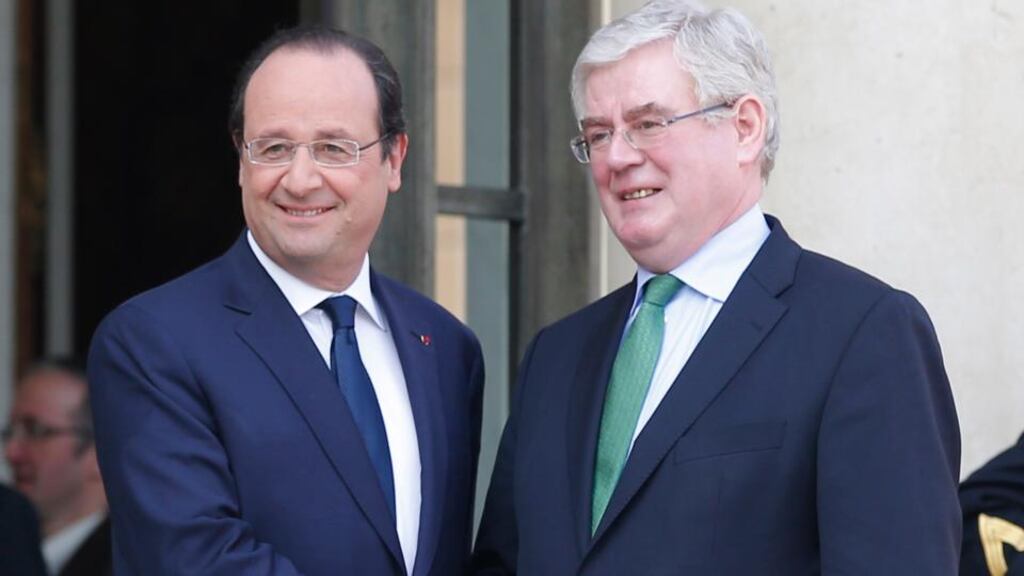 French president François Hollande and Tánaiste Eamon Gilmore after their meeting at the Élysée Palace in Paris yesterday. Photograph: Michel Euler/AP