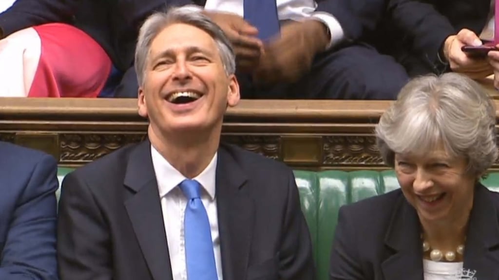 Chancellor Philip Hammond and Prime Minister Theresa May listen to Labour party leader Jeremy Corbyn speaking after Mr Hammond delivered his budget in the House of Commons, London. Photograph: PA Wire.