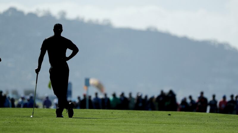 Woods waits to play on the second hole hole. Photo: Gregory Bull/AP Photo