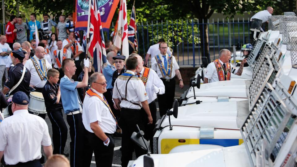 PSNI stop an Orange parade temporarily from passing the Ardoyne shops on the Crumlin road in Belfast. Photograph: Julien Behal/PA Wire