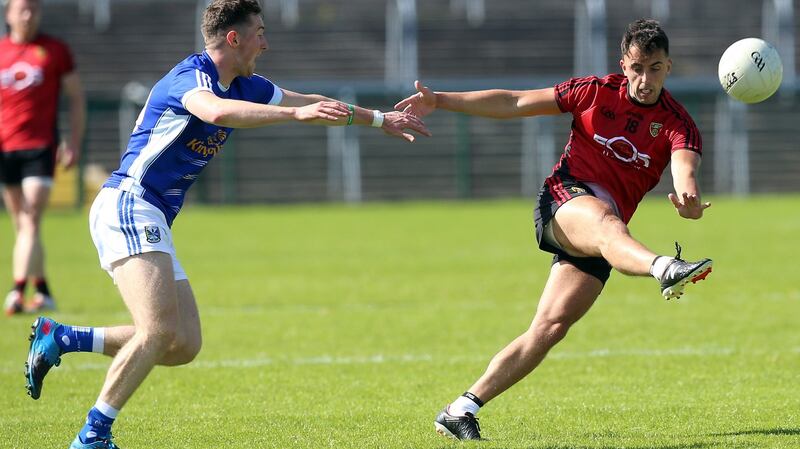 Cavan’s Oisin Kiernan can’t stop Ryan Johnston of Down getting a shot away. Photograph: John McVitty/Inpho