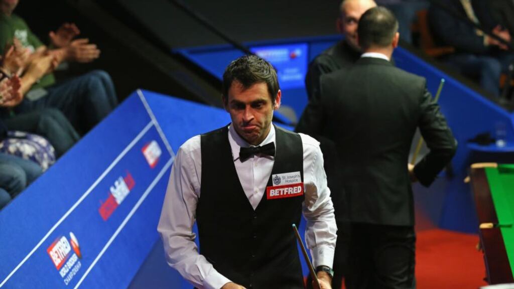 Ronnie O’Sullivan leaves the Crucible arena after defeat to Stuart Bingham in their World Snooker Championship quarter-final. Photo: Alex Livesey/Getty Images