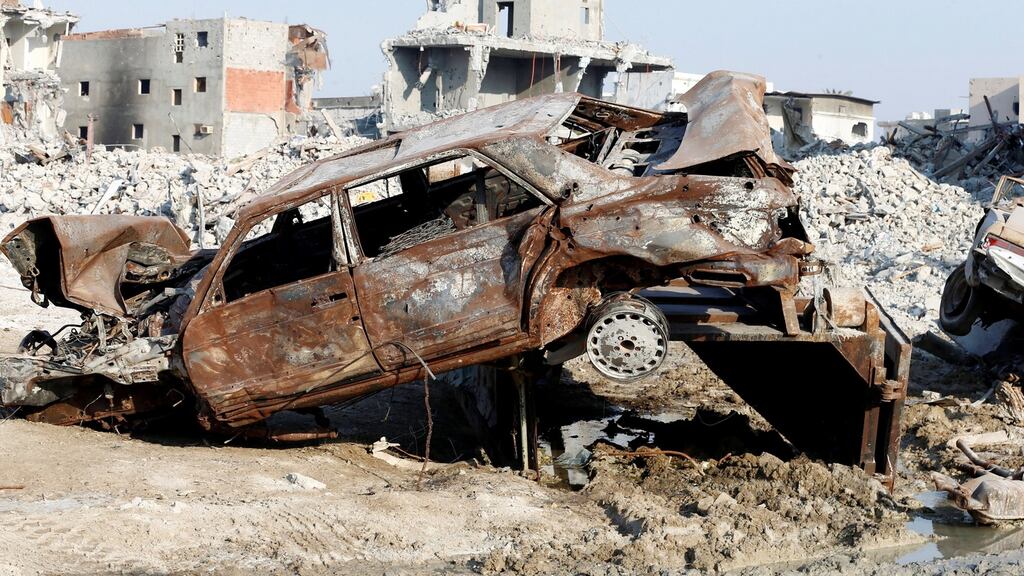 Remains of a car and buildings are seen following a security campaign against Shi’ite Muslim gunmen in the town of Awamiya, in the eastern part of Saudi Arabia. Photograph: Faisal Al Nasser/Reuters