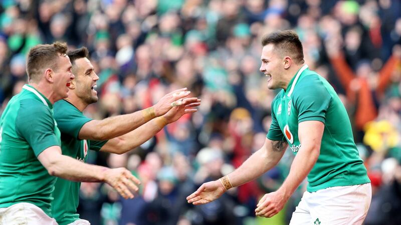 Ireland’s Jacob Stockdale celebrates his second try with Conor Murray and Chris Farrell. Photograph: Tom Honan/The Irish Times.