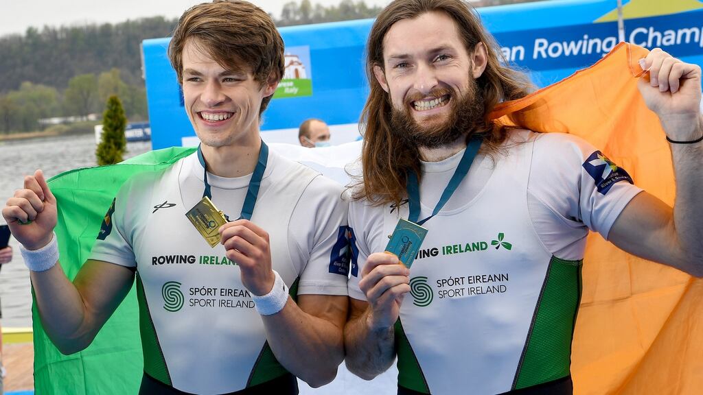 Ireland’s Fintan McCarthy and Paul O’Donovan celebrate their gold medal win in Italy. Photograph: Detlev Seyb/Inpho