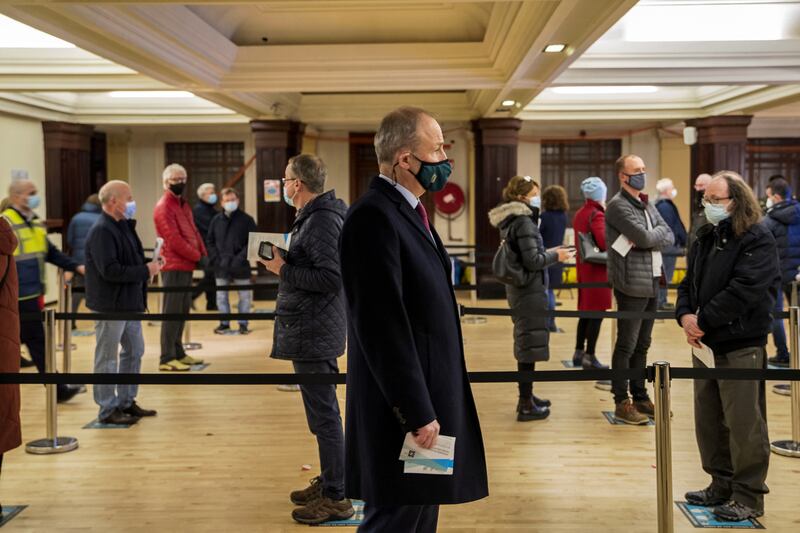Politics 1st – Taoiseach Micheál Martin queuing for his Covid 19 vaccination booster jab at Cork City Hall Vaccination Centre. Photograph: Daragh McSweeney / Provision