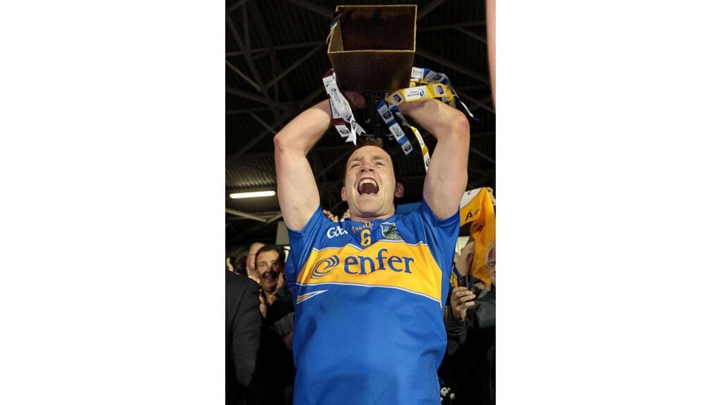 Tipperary's Padraic Maher raises the All-Ireland hurling under-21 trophy after defeating Galway at Semple Stadium (Photograph: Morgan Treacy/Inpho)